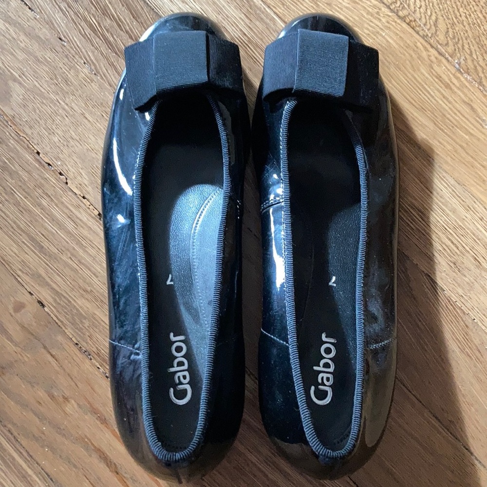 Black patent flats, grosgrain bow.